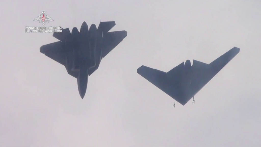 The Su-57 and an earlier version of the S-70 Okhotnik flying together