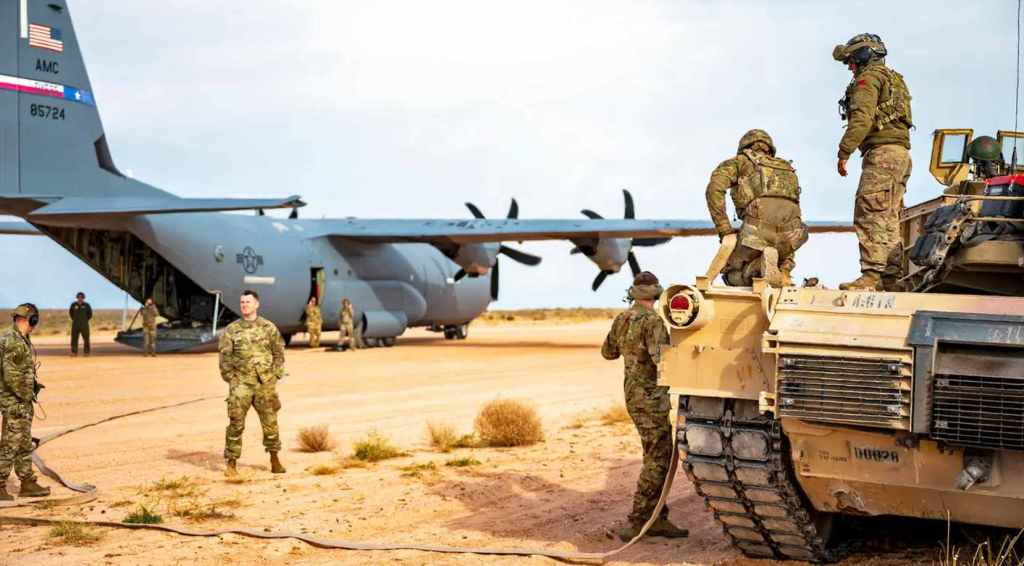 Refueling an M1A2 Abrams tank from a C-130J Super Hercules