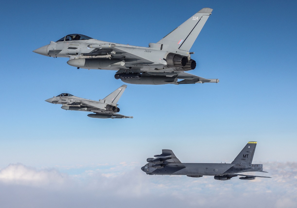 Two Royal Air Force Eurofighter Typhoon and a US Air Force B-52 Stratofortress in flight