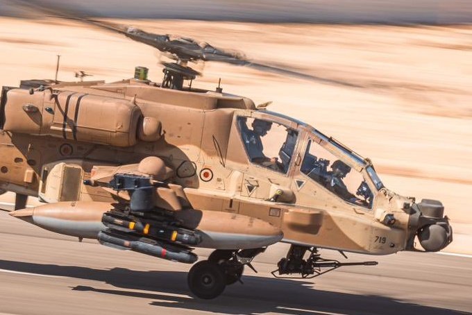 The IsAF AH 64D Apache with the Hellfire missile having the red band and grey colour scheme